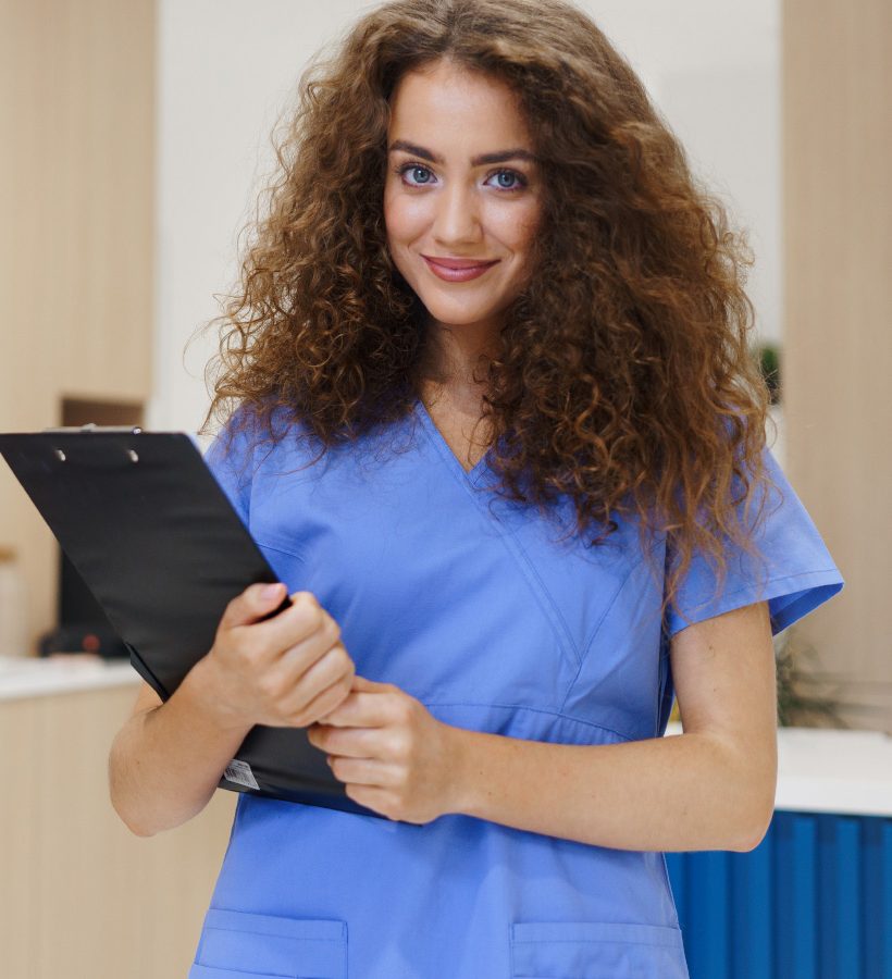 portrait-of-dentist-nurse-posing-at-reception-on-D7Q5QZY.jpg